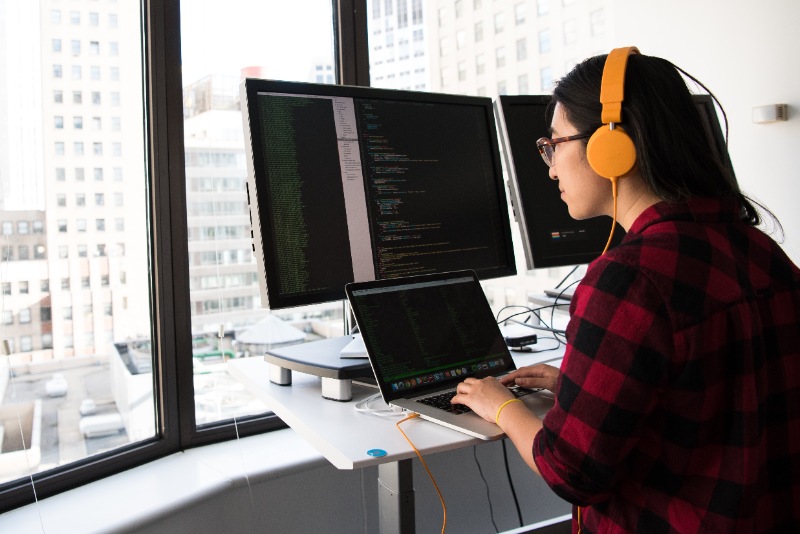 Person coding on a computer