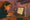 girl attempting a test as a phone is recording her hands, screen and keyboard